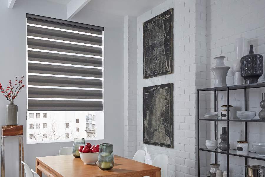 Zebra shade controlling light in a cozy dining area