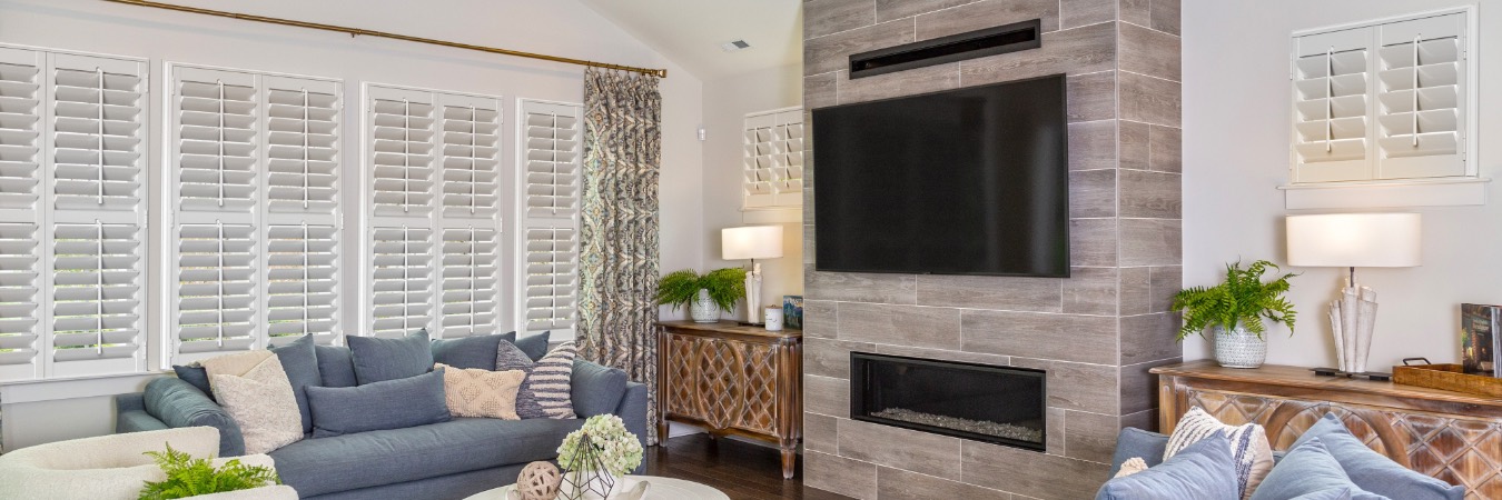 Plantation shutters in Manatee County living room with fireplace
