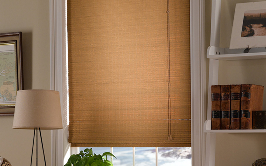 Add a touch of nature to your decor with woven fiber shades in Tampa. Tan woven fiber shades in a living room