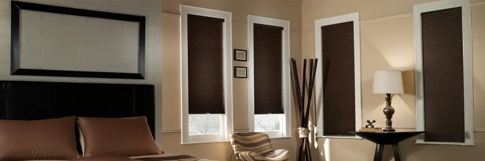 Espresso cellular blackout shades in a stylish bedroom
