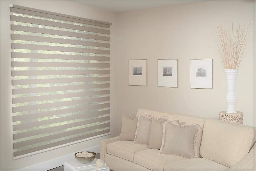 Zebra shades give you a unique combination of light control and style that benefits your Tampa home. Zebra shade allows filtered light into a living room