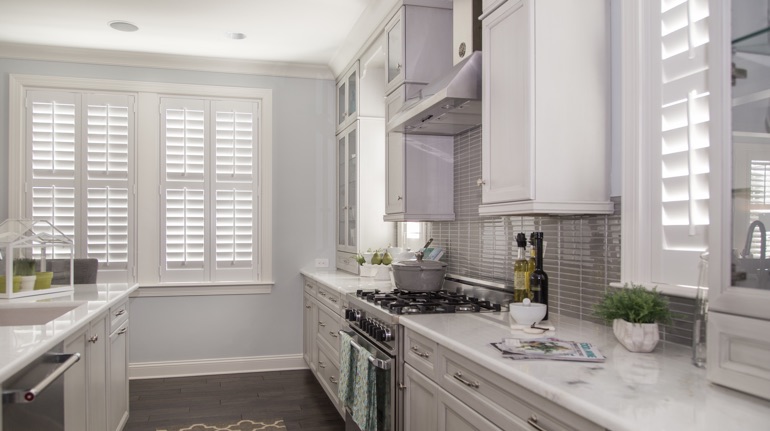 White shutters in Tampa kitchen with modern appliances.