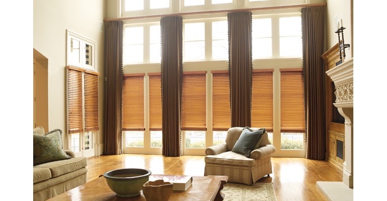 Tampa great room with natural wood blinds and full-length draperies.