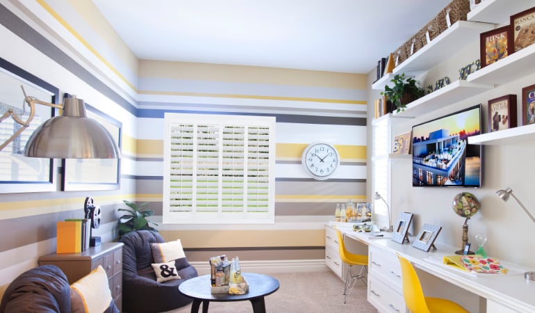 Polywood® shutters are a viable option for any room. Polywood® shutters in a home office.