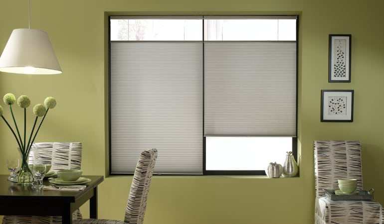 Cellular shades will keep a room's temperature consistent and reduce energy costs. Cellular shades in a Tampa dining room