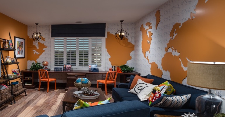 Plantation shutters are the perfect window treatment for a study area. Family room with wall map and plantation shutters