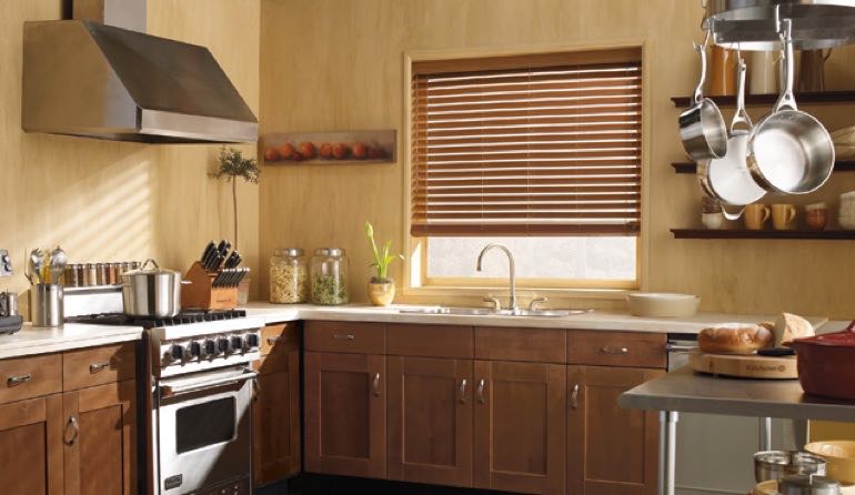 Faux wood blinds look amazing in Tampa kitchens. Tampa kitchen faux wood blinds.