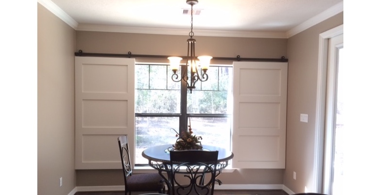 Barn doors open horizontally with slides instead of cords. Tampa barn door shutters