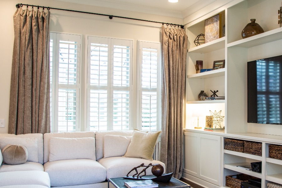 Install sun-resistant Polywood shutters in Tampa. Shutters in a living room
