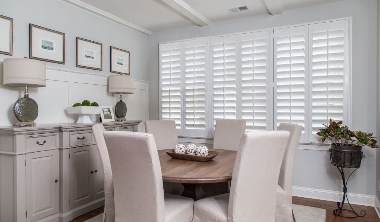Plantation shutters are a perfect choice for homeowners looking for privacy or natural light. Plantation shutters in a Tampa dining room.