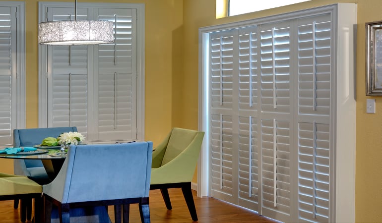 Plantation shutters on a French door act like common window shutters. Patio Doors with Plantation Shutters in Tampa