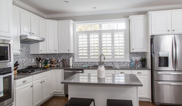 Polywood® plantation shutters resist heat and moisture in your kitchen. Polywood shutters in a Tampa gourmet kitchen.