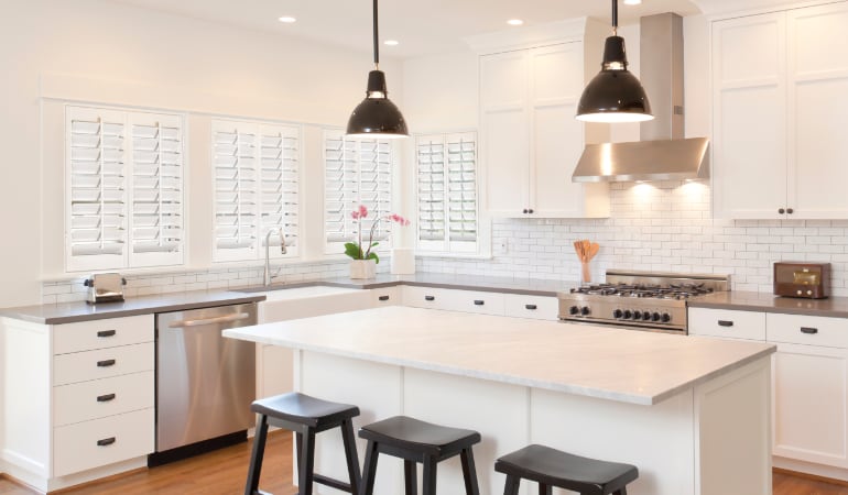 Plantation shutters let you control the amount of light in your kitchen. Plantation shutters in a bright Tampa kitchen.