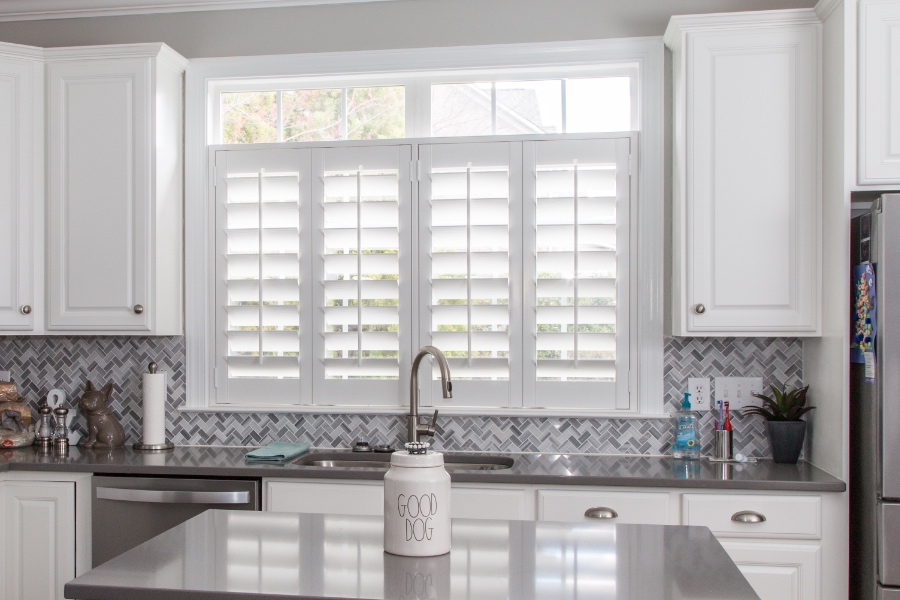 Classic Polywood interior shutters in Tampa are moisture-resistant. White Polywood shutters above a kitchen sink