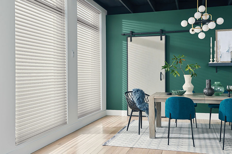 Versatile sheer shades let you decide how much of a view you want while enjoying your Tampa dining room. White sheer shades on windows in a green dining room