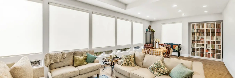White shades on large living room windows