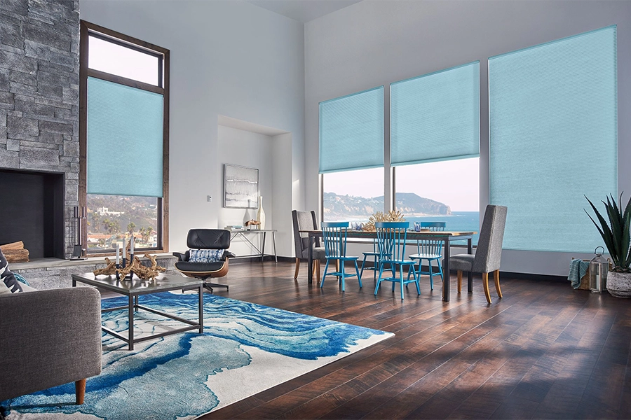 Smart motorized window shades are perfect on tall windows in your Tampa home. Blue motorized shades on tall living room windows