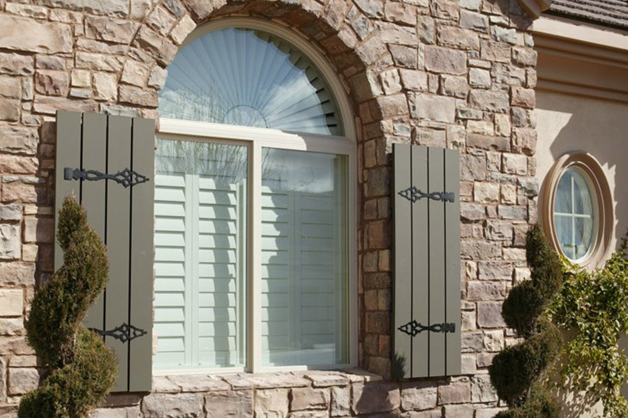 Add a bit of character and whimsy to your home with exterior shutters. Exterior shutters displayed with interior white Polywood shutters.