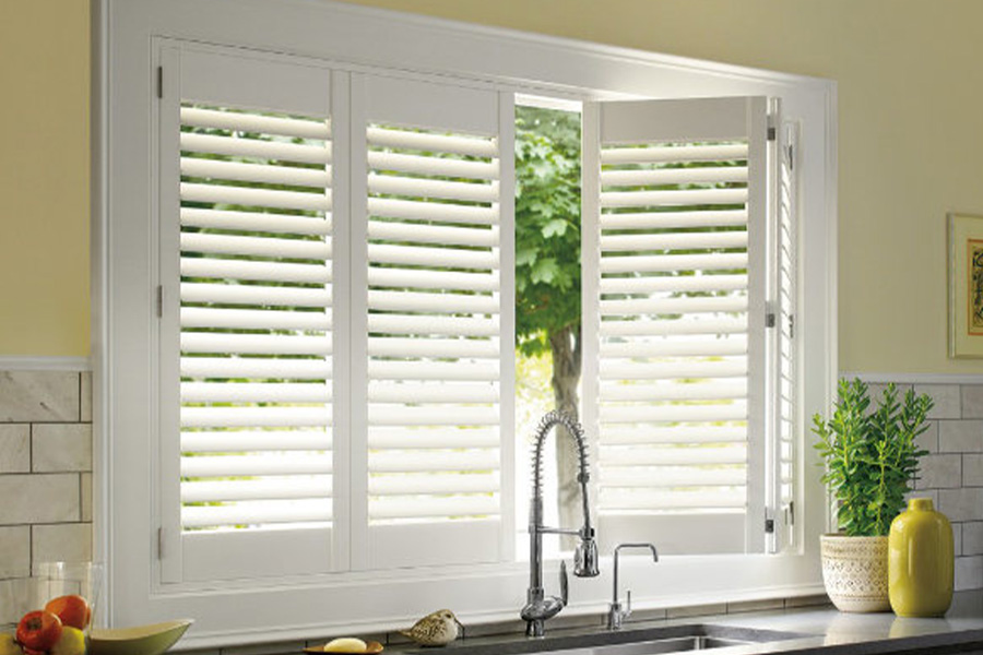 Polywood shutters are built to withstand the test of time in Tampa. White Polywood shutters above a kitchen sink.
